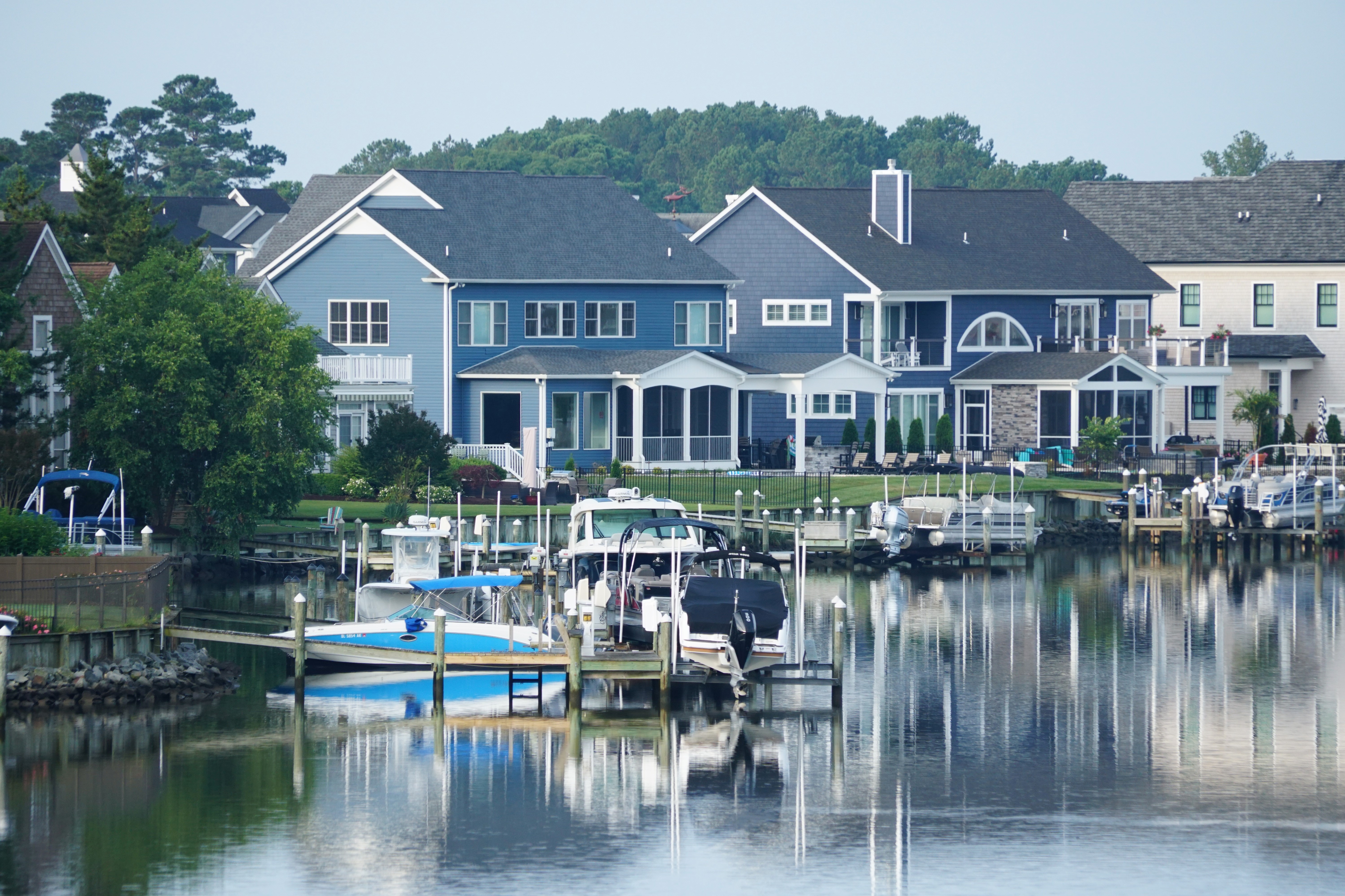 A neighborhood in Rehoboth Beach, DE with a marina and boats