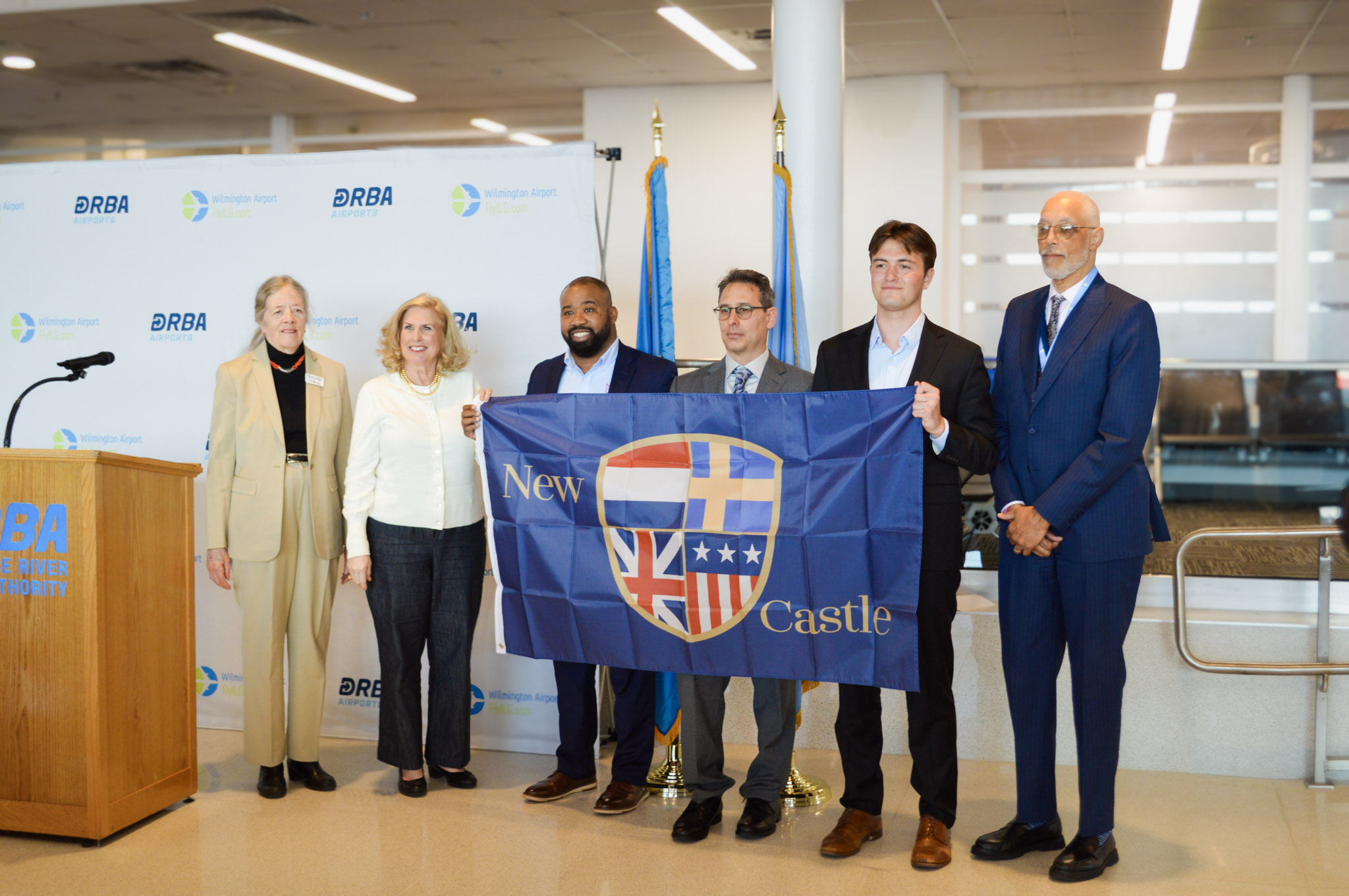 Representatives of the Bellanca Family receive the New Castle Flag from a City Commissioner