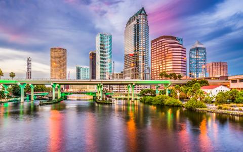 Tampa Bay skyline at sunset featuring a bridge