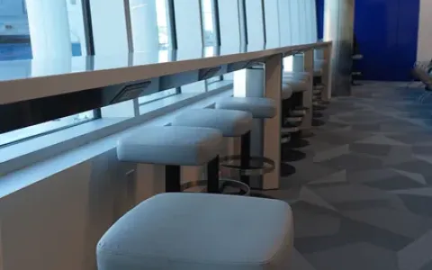 Single seating in the new terminal overlooking the airport apron and planes at Wilmington Airport ILG