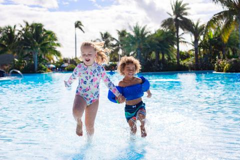 Toddlers playing in a wading pool in Florida